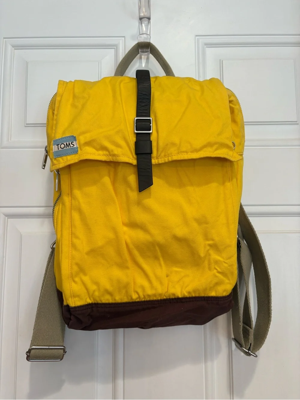 TOMS Citrus Waxed Canvas Trekker Backpack with Brown Base and Roll-Top Closure